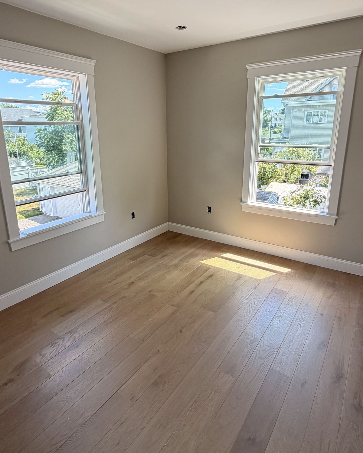 Same bedroom after: craftsman window casings and baseboards installed