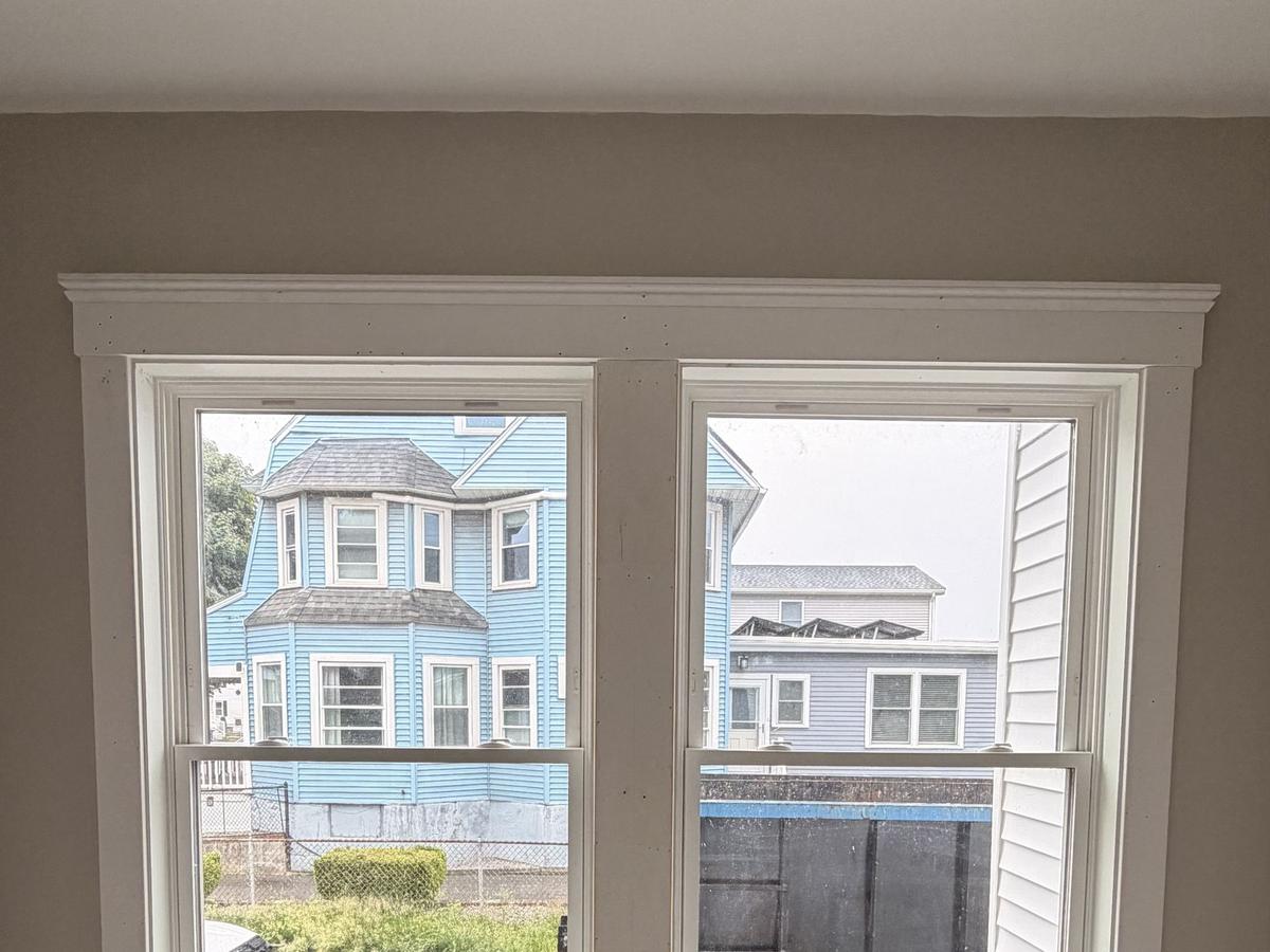 Double window with craftsman casing